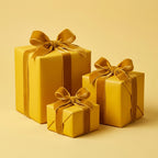 Three yellow gifts wrapped in solid color paper with velvet ribbons.