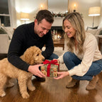 Goldendoodle Christmas wrapping paper by Wrapped Studios on a gift held by a couple with their puppy.