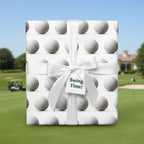 Square gift wrapped in golf ball wrapping paper with white ribbon and "Swing Time!" tag.