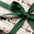 Vintage golf cart wrapping paper with a dark green ribbon, luxury golf gift wrap from Wrapped Studios.