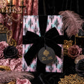 Gothic pink and black damask luxury wrapping paper with a velvet bow by Wrapped Studios.
