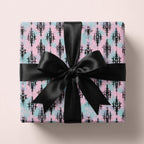 Pink and mint pastel goth wrapping paper with black damask pattern and bow by Wrapped Studios.