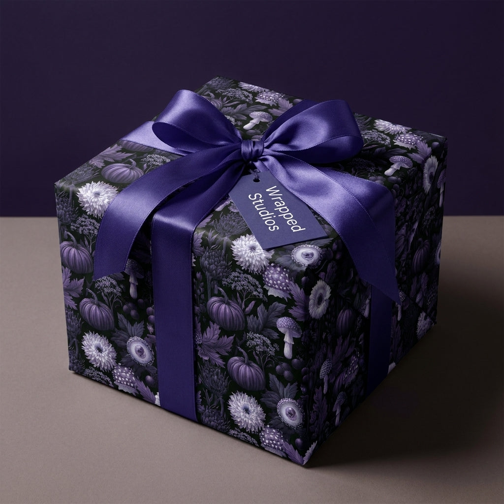 Dark purple gothic wrapping paper with a botanical mushroom pattern on a gift box by Wrapped Studios.