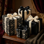 Wrapped Studios luxury gift wrap set: dark floral bird paper, black and cream elegant presents with velvet ribbons.