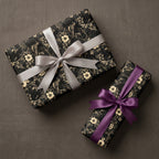 Luxury vintage floral wrapping paper with gold flowers & birds, tied with silver & purple satin ribbons. Wrapped Studios.