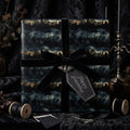 Elegant Halloween wrapping paper with black velvet ribbon and "Happy Haunting" tag.