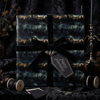 Elegant Halloween wrapping paper with black velvet ribbon and "Happy Haunting" tag.