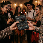 Spooky Halloween party scene with gift wrapped in haunted forest paper and tied with twine.