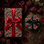 Romantic gothic heart wrapping paper on luxury gift boxes with red and black bows, by Wrapped Studios.