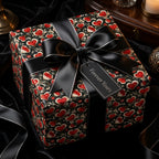 Gothic heart wrapping paper with a black satin bow on a romantic luxury gift box by Wrapped Studios.