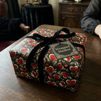 Luxury gothic heart wrapping paper with a black velvet bow and Wrapped Studios gift tag.