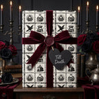 Gothic wedding gift wrap with skulls, burgundy velvet bow, and Till Death tag by Wrapped Studios.
