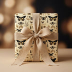 Elegant gift in botanical butterfly wrapping paper with tan linen ribbon.
