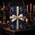 Luxury Wrapped Studios gift box featuring gothic crow and floral patterned wrapping paper with a cream silk ribbon bow.