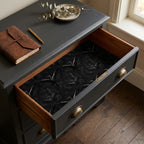 Dark academia gothic raven wrapping paper with flying black crows in a drawer, by Wrapped Studios.