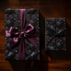 Gothic raven wrapping paper with a purple satin bow, dark moody Halloween gift wrap by Wrapped Studios.
