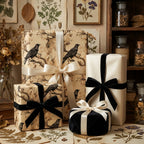 Elegant gifts wrapped in bird-themed wrapping paper and tied with satin ribbon from Wrapped Studios.