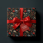 Luxury dark floral gift wrap with red hearts and a satin bow by Wrapped Studios.