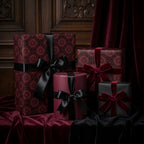 Luxury gothic wrapping paper in burgundy and black with elegant velvet bows by Wrapped Studios.