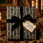 Gothic skull wrapping paper with black velvet bow and 'Eternally Yours' tag by Wrapped Studios.