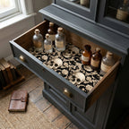Gothic skull wrapping paper used as a vintage cabinet drawer liner, by Wrapped Studios.