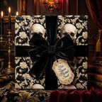 Gothic skull wrapping paper with a black velvet bow and vintage gift tag by Wrapped Studios.