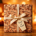 Spooky skull Halloween wrapping paper with cream bow and Trick or Treat tag by Wrapped Studios.