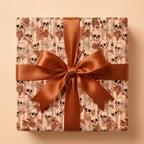 Gothic skull Halloween wrapping paper on a gift box with a brown satin bow, by Wrapped Studios.