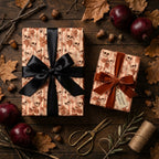Gothic skull wrapping paper with black and velvet ribbons on a rustic autumn table by Wrapped Studios.