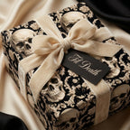 Gothic wedding wrapping paper with luxury skull pattern, velvet bow, and Til Death tag by Wrapped Studios.