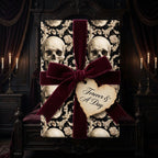 Gothic skull wrapping paper with a luxury burgundy velvet ribbon for dark romance weddings, by Wrapped Studios.