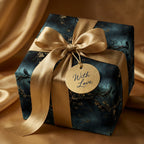 Elegant gift wrapped in floral bird wrapping paper with gold ribbon and "With Love" tag.