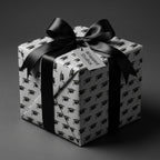 Graduation gift wrap with black and white mortarboard pattern and a satin bow, by Wrapped Studios.