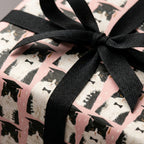 Pink cat graduation wrapping paper with black bow tie pattern and black ribbon by Wrapped Studios.
