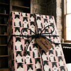 Funny pink cat graduation wrapping paper with black twine and wooden tag by Wrapped Studios.