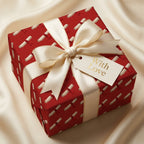 Elegant red graduation wrapping paper with diploma pattern and cream ribbon bow by Wrapped Studios.