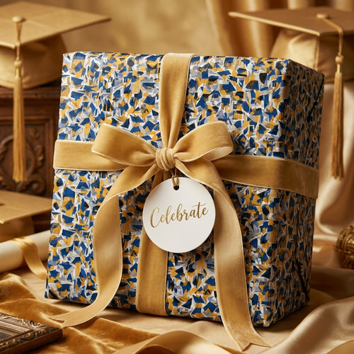 Luxury graduation gift wrapped in mosaic paper with a gold velvet ribbon and 'Celebrate' tag by Wrapped Studios.