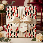 Graduation wrapping paper featuring black and red graduate pattern with cream satin bow by Wrapped Studios.