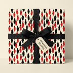 Graduation wrapping paper with red and black graduate pattern and black bow by Wrapped Studios.