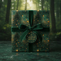 Elegant emerald green gift wrap with gold stars, tied with velvet ribbon and a "special wish" tag.