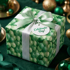 Luxury green balloon wrapping paper with a satin ribbon and celebration tag, by Wrapped Studios.
