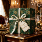 Luxury emerald green and gold wedding gift wrap with a cream ribbon bow, by Wrapped Studios.