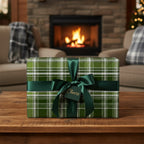 Elegant green plaid gift wrap with a satin ribbon bow for Christmas or a special occasion.