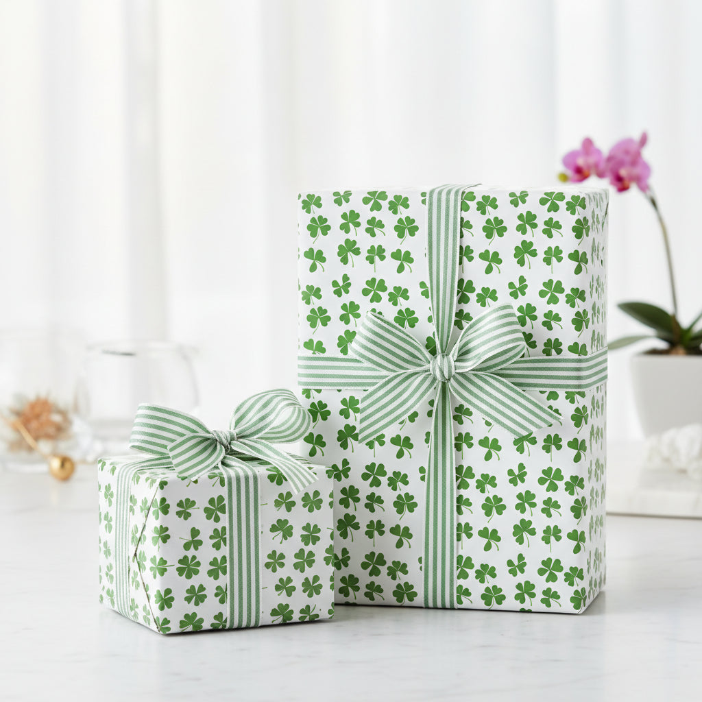 Two gifts wrapped in cloverleaf pattern paper with green striped ribbon.