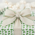 St. Patrick's Day gift with clover wrapping paper and linen bow.
