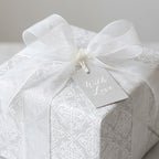 Elegant grey damask wedding wrapping paper with white ribbon and 'With Love' tag by Wrapped Studios.