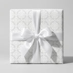 Elegant white damask wedding wrapping paper with a satin bow by Wrapped Studios.