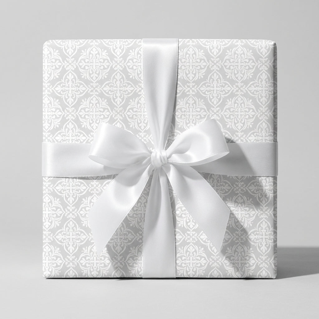Elegant white damask wedding wrapping paper with a satin bow by Wrapped Studios.