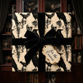 Gothic skull and raven wrapping paper with a black velvet bow. Halloween gift wrap by Wrapped Studios.