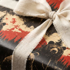 Rustic woodland wrapping paper featuring bears and trees, tied with a natural linen ribbon bow.